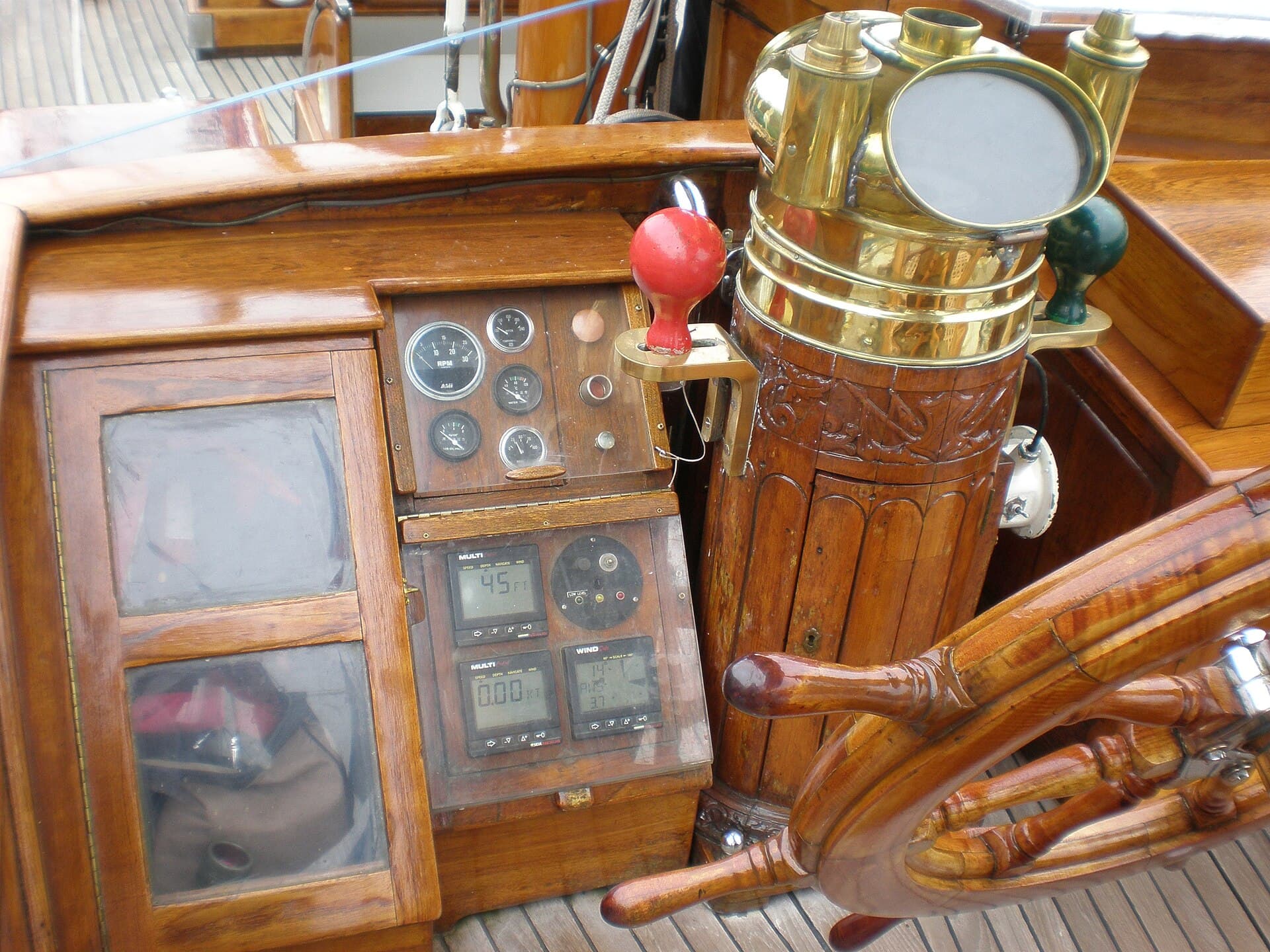 A sailing helm with compass and instrument readouts